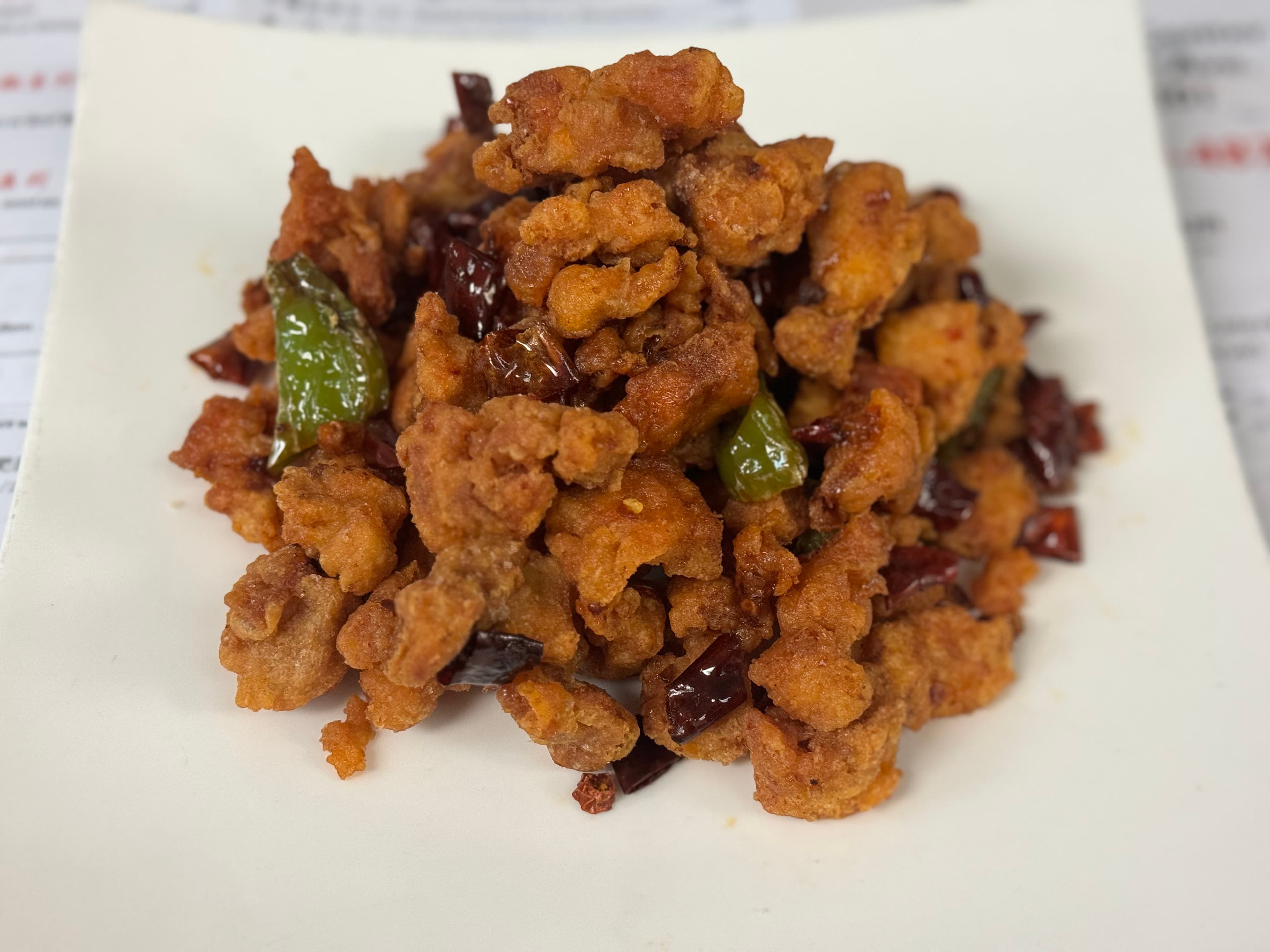 Dry chili chicken with green peppers